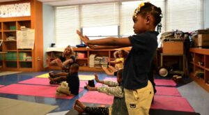 Kids doing yoga at school